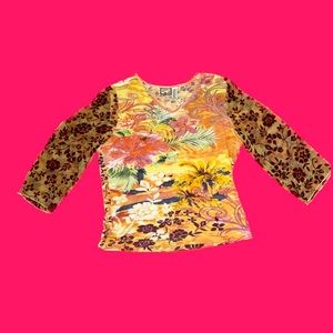 Woman’s long sleeve shirt. mesh sleeves, bedazzled with flowers.